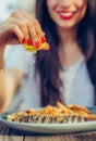 Woman squeeze lemon on portion of fish in a restaurant Royalty Free Stock Photo