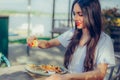 Woman squeeze lemon on portion of fish in a restaurant Royalty Free Stock Photo