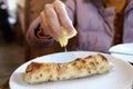 Woman squeezes lemon juice on kebab Royalty Free Stock Photo