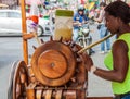 Woman is squeezing sugar cane juice Royalty Free Stock Photo