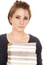 Woman stack of books holding very serious