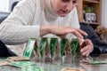 Woman stacking a tower from playing cards. Royalty Free Stock Photo