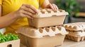 A woman is stacking up some boxes of food on a table, AI Royalty Free Stock Photo