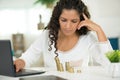 woman with stacks coins using laptop Royalty Free Stock Photo