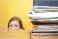 Woman stairing fearfully at files Royalty Free Stock Photo