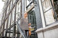 Woman on the stairs near luxury house Royalty Free Stock Photo