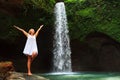 Woman stand under waterfall Royalty Free Stock Photo