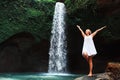 Woman stand under waterfall Royalty Free Stock Photo