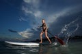 Woman stand up paddle boarding