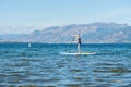 Woman on stand-up paddleboard on Okanagan Lake, Penticton, BC, Canada