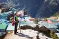 Woman standing above mountain village buildings. Royalty Free Stock Photo