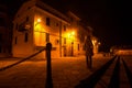 Woman standing in Alghero promenade at night