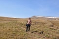 A woman is standing on an alpine plateau. Caucasian Reserve, Russia