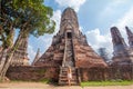 Woman standing back in front of the Wat Chaiwatthanaram in Ayutthaya