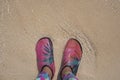 Woman standing on the beach sand and wearing wading shoes, beach of Krabi Royalty Free Stock Photo