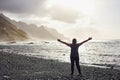 Woman standing on black sand volcanic Beniho Benijo Beach - North part of Tenerife. Canary Islands. Spain Royalty Free Stock Photo