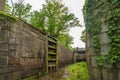 Woman standing on bridge over lock