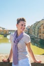 Woman standing on bridge overlooking ponte vecchio Royalty Free Stock Photo