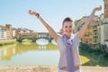 Woman standing on bridge overlooking ponte vecchio Royalty Free Stock Photo