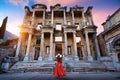 Woman standing in Celsus Library at Ephesus ancient city in Izmir, Turkey. Royalty Free Stock Photo