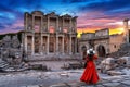 Woman standing in Celsus Library at Ephesus ancient city in Izmir, Turkey