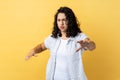 Woman standing with closed eyes and outstretched hands, trying to find obstacles while walking blind