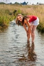 Woman standing in creek in summer Royalty Free Stock Photo