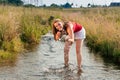 Woman standing in creek in summer Royalty Free Stock Photo