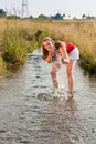 Woman standing in creek summer Royalty Free Stock Photo