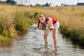 Woman standing in creek summer Royalty Free Stock Photo