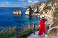 Woman standing on Diamond beach in Nusa penida island, Bali in Indonesia. Royalty Free Stock Photo