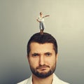 Woman standing on the displeased man Royalty Free Stock Photo