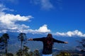 A woman standing at Dochula Pass