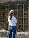 Woman Standing by the EAA Memorial Wall in Oshkosh, WI home to the Experimental Aircraft Association (EAA)