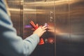 Woman Standing In Elevator And Pressing Button