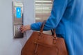 Woman Standing In Elevator And Pressing Button Royalty Free Stock Photo