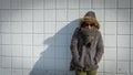 Woman standing in front of White tile wall Royalty Free Stock Photo