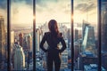 Woman Standing in Front of Window, Looking Out at City Royalty Free Stock Photo