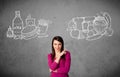 Woman standing between healthy and unhealthy foods Royalty Free Stock Photo