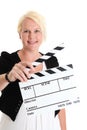 Woman standing holding a movie slate Royalty Free Stock Photo