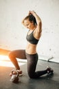 Woman standing on knee and preparing for cross fit exercise Royalty Free Stock Photo