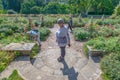 Woman standing in the middle of a circular staircase, Bodnant garden, Wales