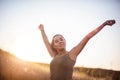 Woman standing in the nature with closed eyes and outstretched arms Royalty Free Stock Photo