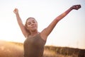 Woman standing in the nature with closed eyes and outstretched arms Royalty Free Stock Photo