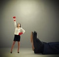 Woman standing near big legs Royalty Free Stock Photo