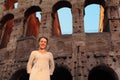 Woman standing near Colosseum