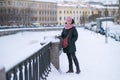 Woman standing near Griboedov Canal in winter, St. Petersburg, Russia. Royalty Free Stock Photo