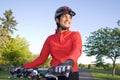 Woman Standing Next to Bicycle - Horizontal Royalty Free Stock Photo