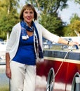 Woman standing next to a boat