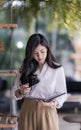 woman standing at the office and looking at her diary Royalty Free Stock Photo